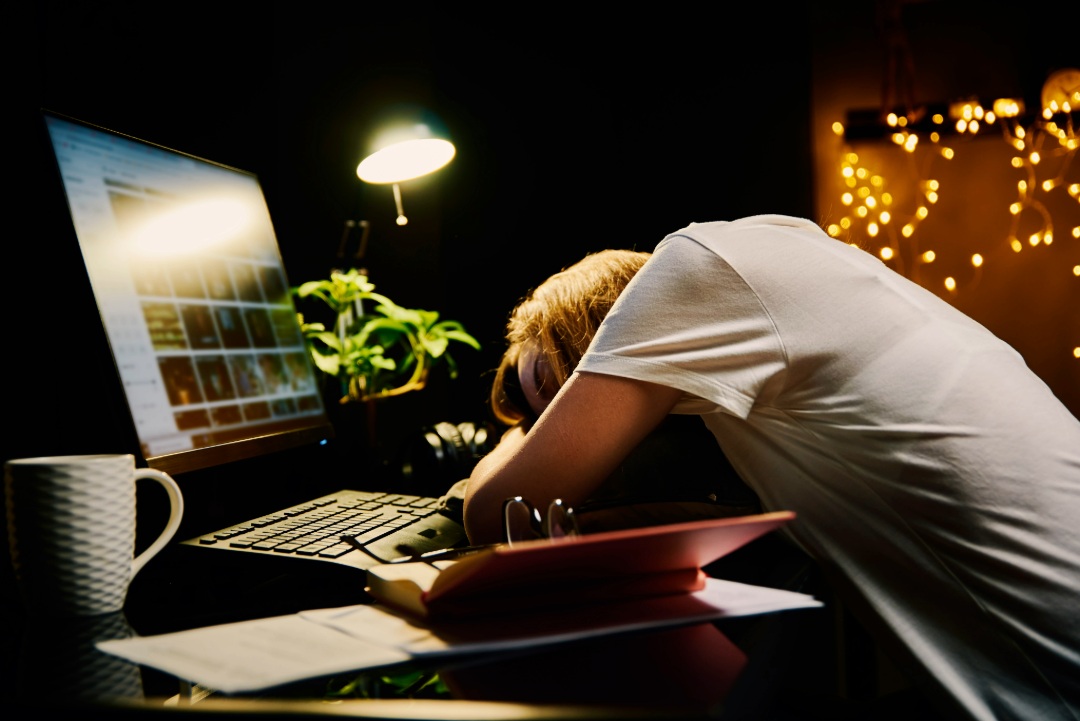 business owner works late in front of laptop